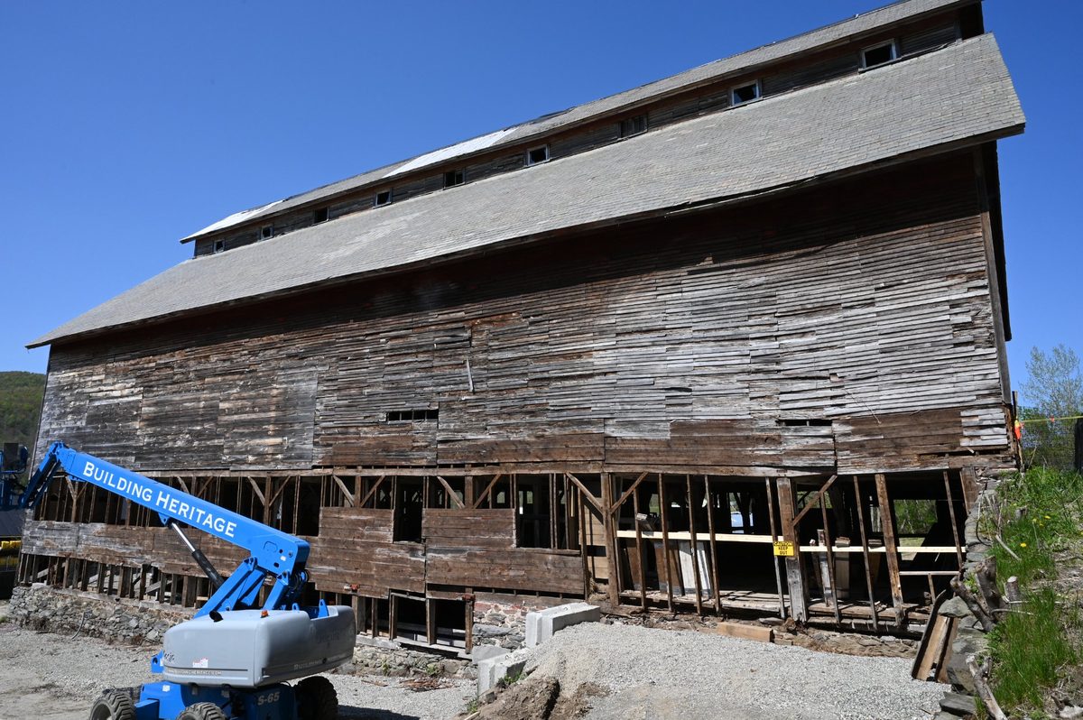 The East Monitor Barn during early restoration, with Building Heritage crane